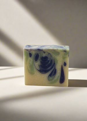 Swirl patterned soap bar on with neutral background.