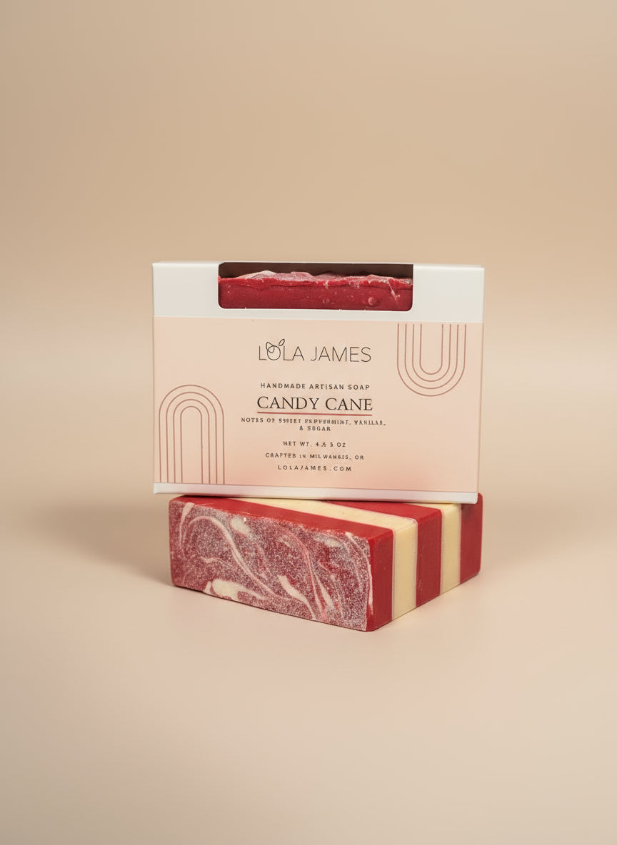 Red and white candy cane soap with packaging on a beige background