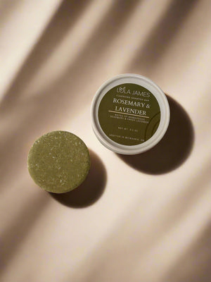 Green Rosemary & Lavender shampoo bar, beige background with shadows.