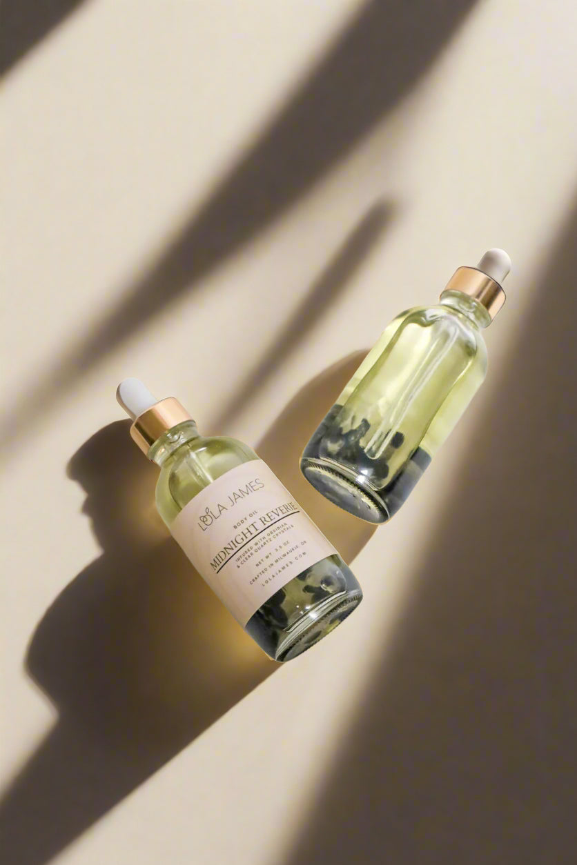 Two skincare bottles with labels on a light gray background