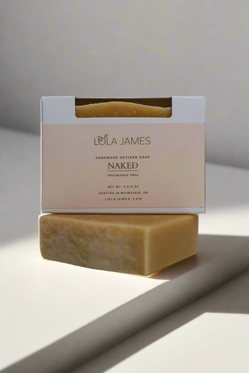 Bar of soap with Lola James packaging on a white background