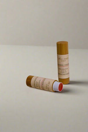 2 bamboo containers of Cherry Lip Balm with a neutral background.