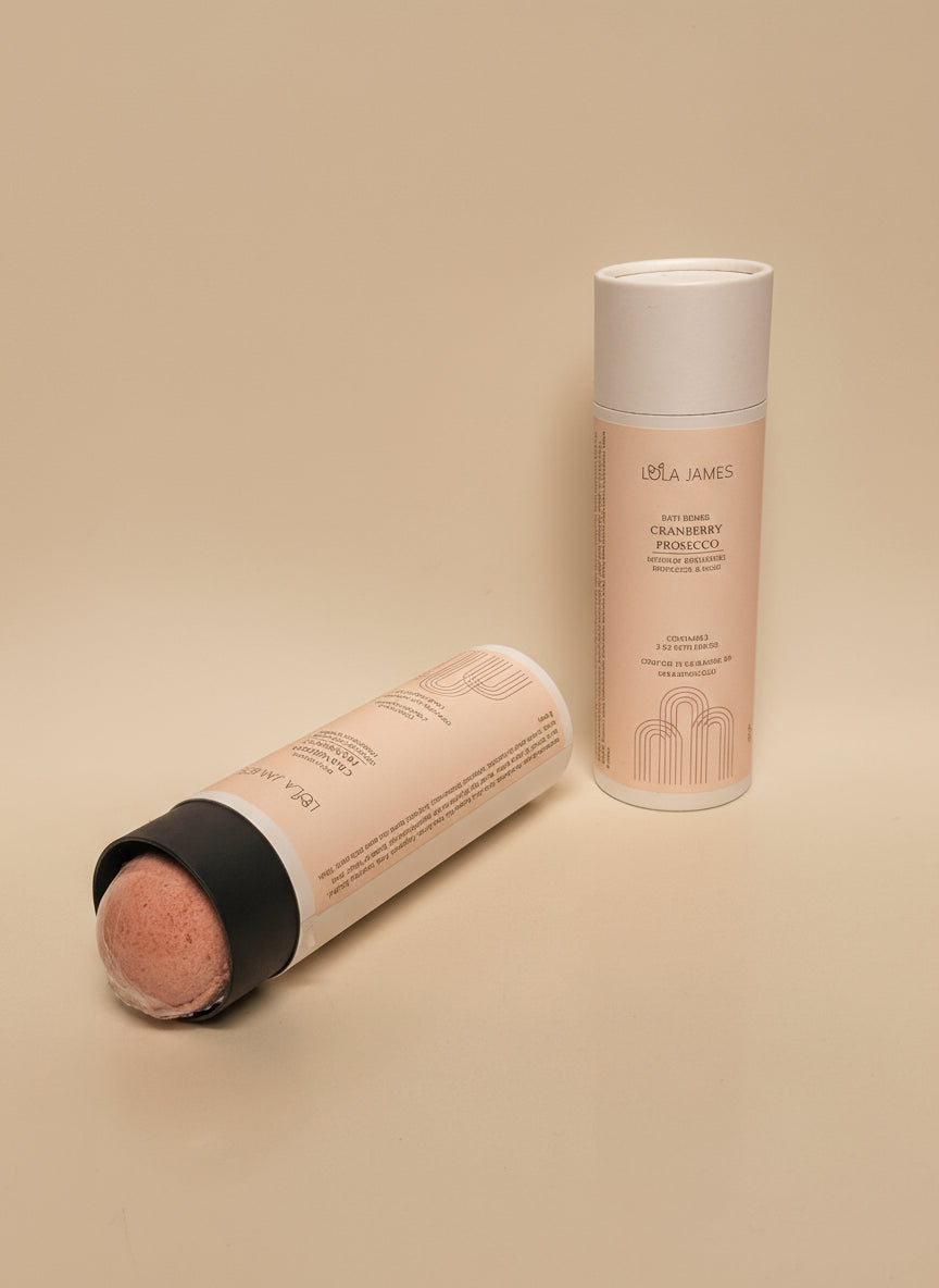 Lola James bath bomb tube packaging on a cream background