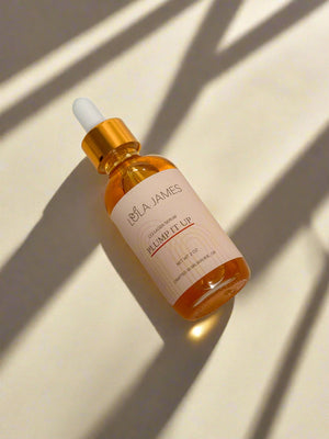 Bottle of facial oil with gold lid.