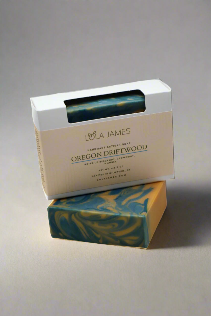 Bar of soap with packaging labeled 'Lola James' on a white background