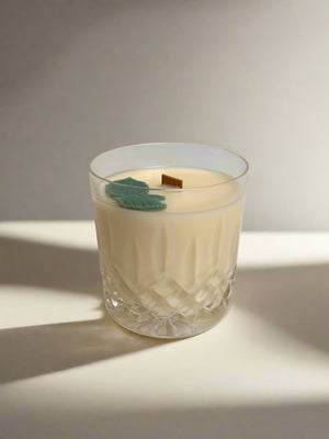 Crystal cut glass vessel with soy wax candle and wooden wick. Sage leaf embeds.