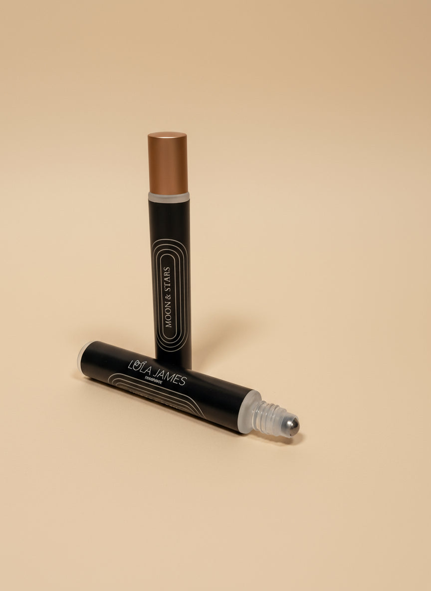 Two rollerball fragrance with 'Lola James' branding on a tan background