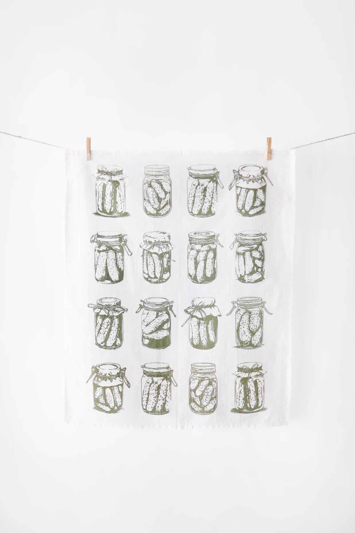 Tea towel with pickle jar pattern on a white background